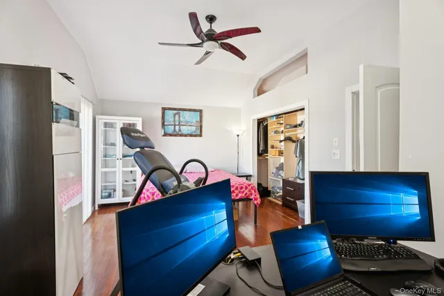 a living room with furniture gym equipment and a fireplace