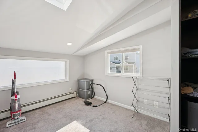 a room with gym equipment and a flat screen tv