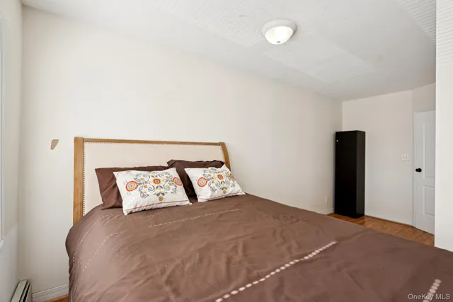 a bedroom with a bed and lamp