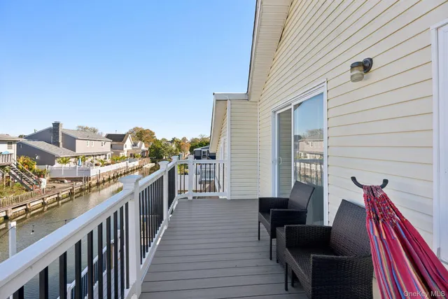 a view of a balcony with furniture