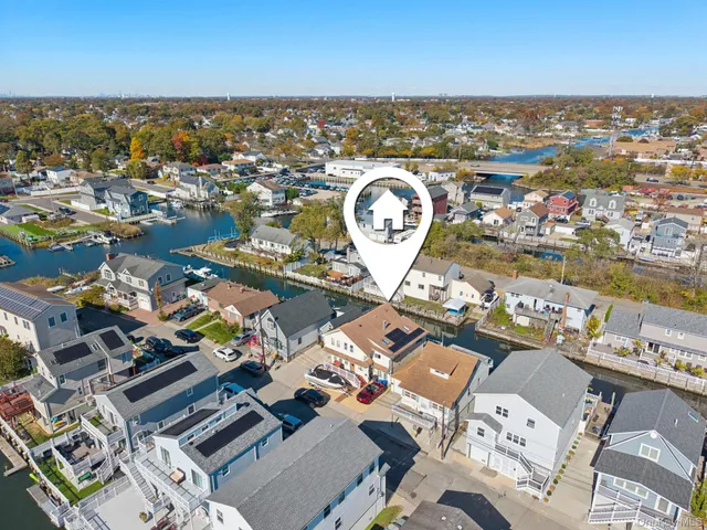 an aerial view of a city with ocean view