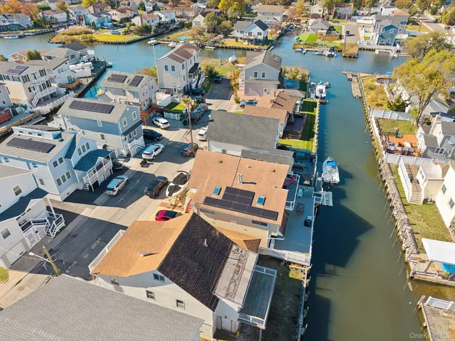 an aerial view of a house with a lake view