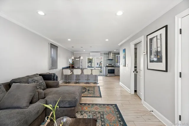 a living room with furniture and a rug
