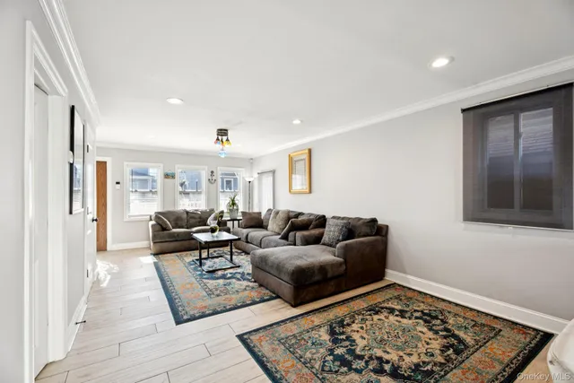a living room with furniture and a rug