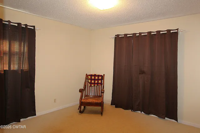 a bedroom with a bed and lamp