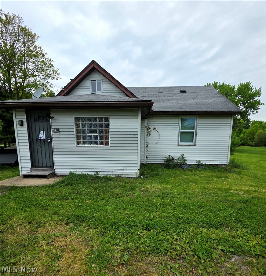 6270 Fairview Road Youngstown, OH 44515 - Photo 1 of 3 Vinyl siding exterior with a dark shingle roof