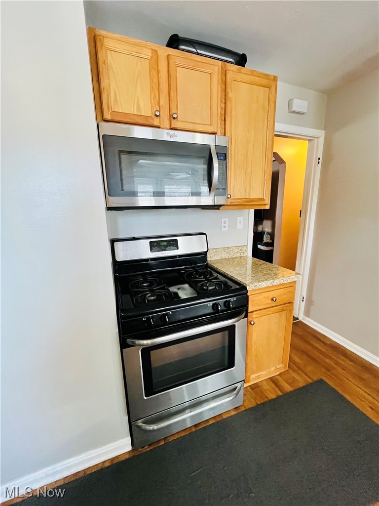 30009 Elgin Road Wickliffe, OH 44092 - Photo 26 of 44 Kitchen featuring appliances with stainless steel finishes, dark hardwood / wood-style floors, and light brown cabinets