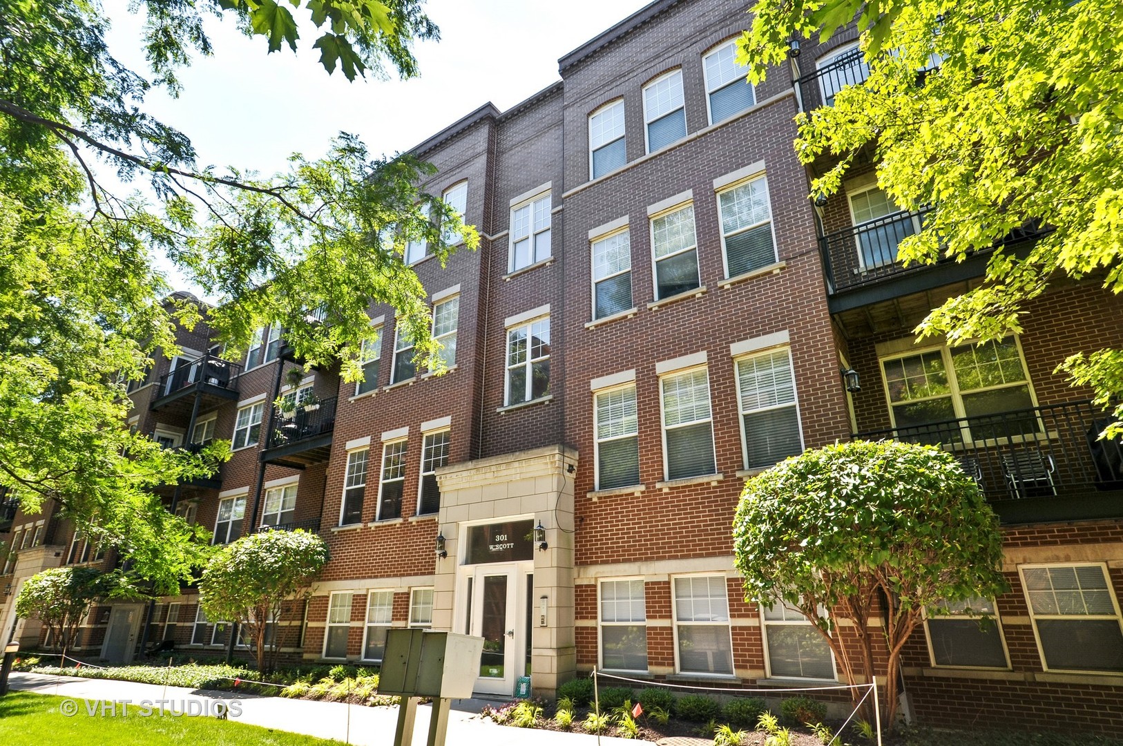 301 West Scott Street, Unit 204 Chicago, IL 60610 - Photo 1 of 11 a front view of a multi story residential apartment buildings