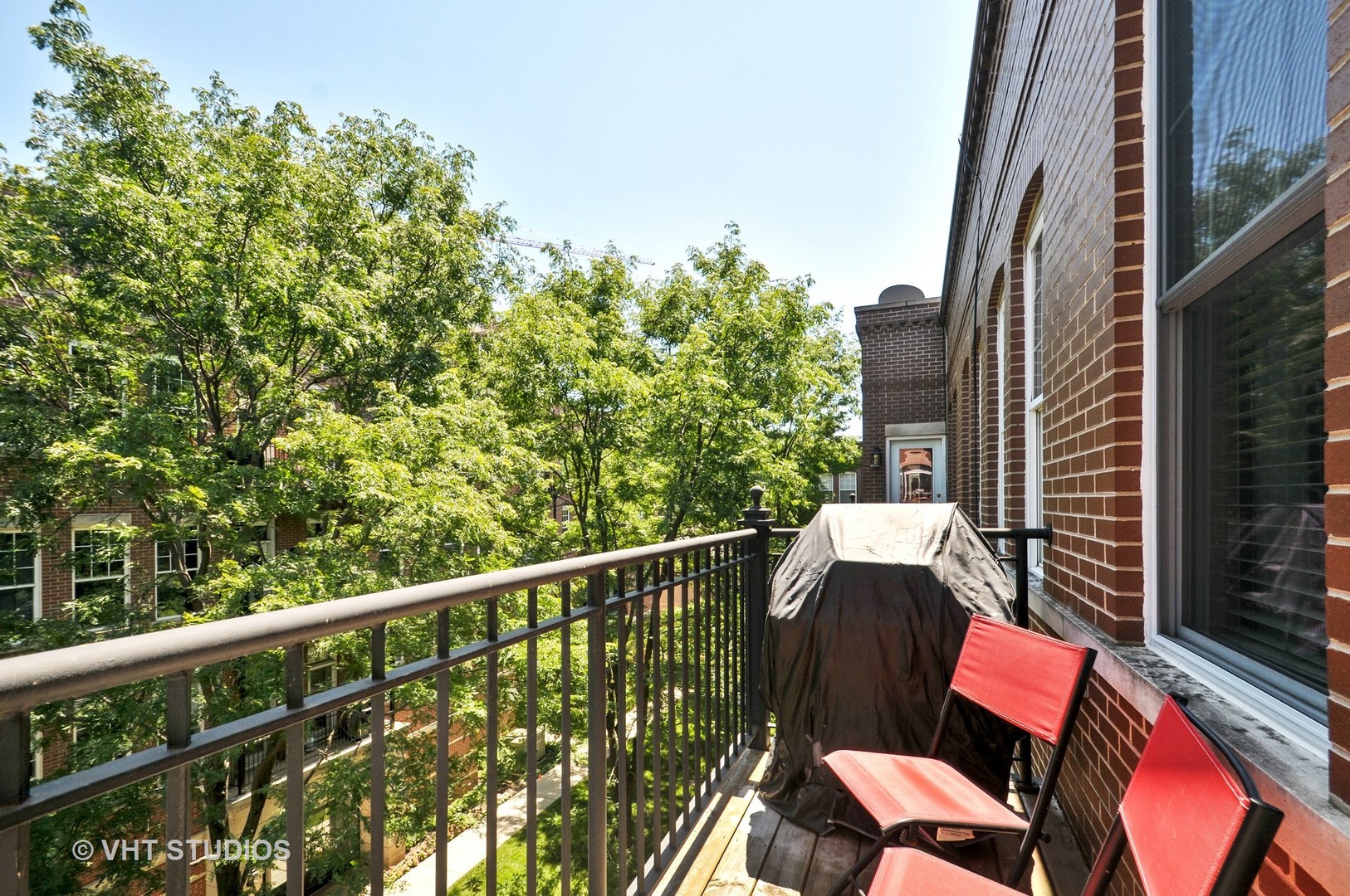 301 West Scott Street, Unit 204 Chicago, IL 60610 - Photo 11 of 11 a view of a chairs and table in the balcony
