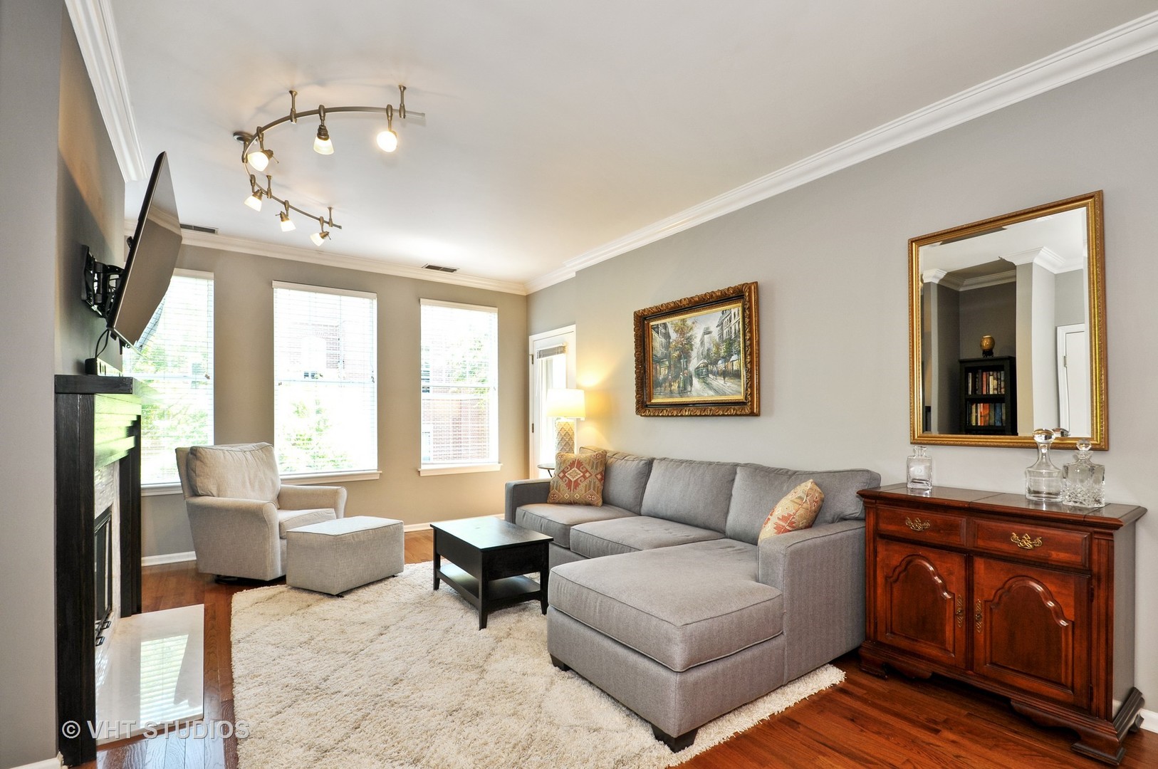 301 West Scott Street, Unit 204 Chicago, IL 60610 - Photo 2 of 11 a living room with furniture a large window and a flat screen tv