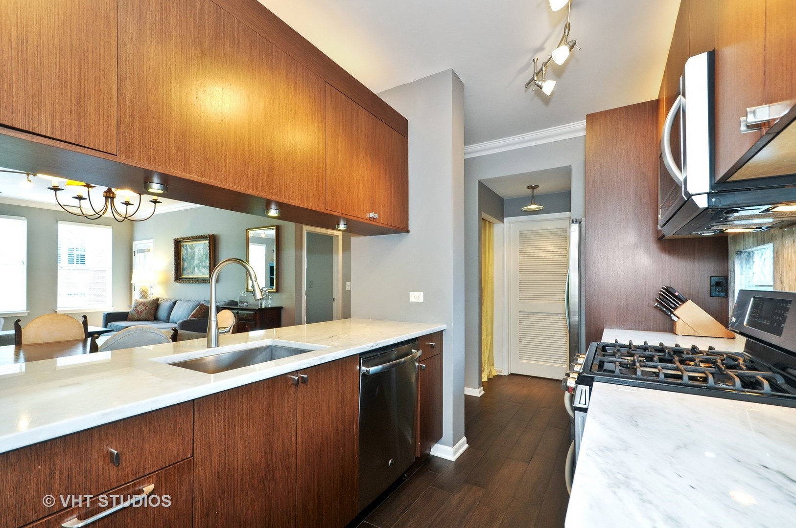 301 West Scott Street, Unit 204 Chicago, IL 60610 - Photo 5 of 11 a bathroom with a double vanity sink and a mirror