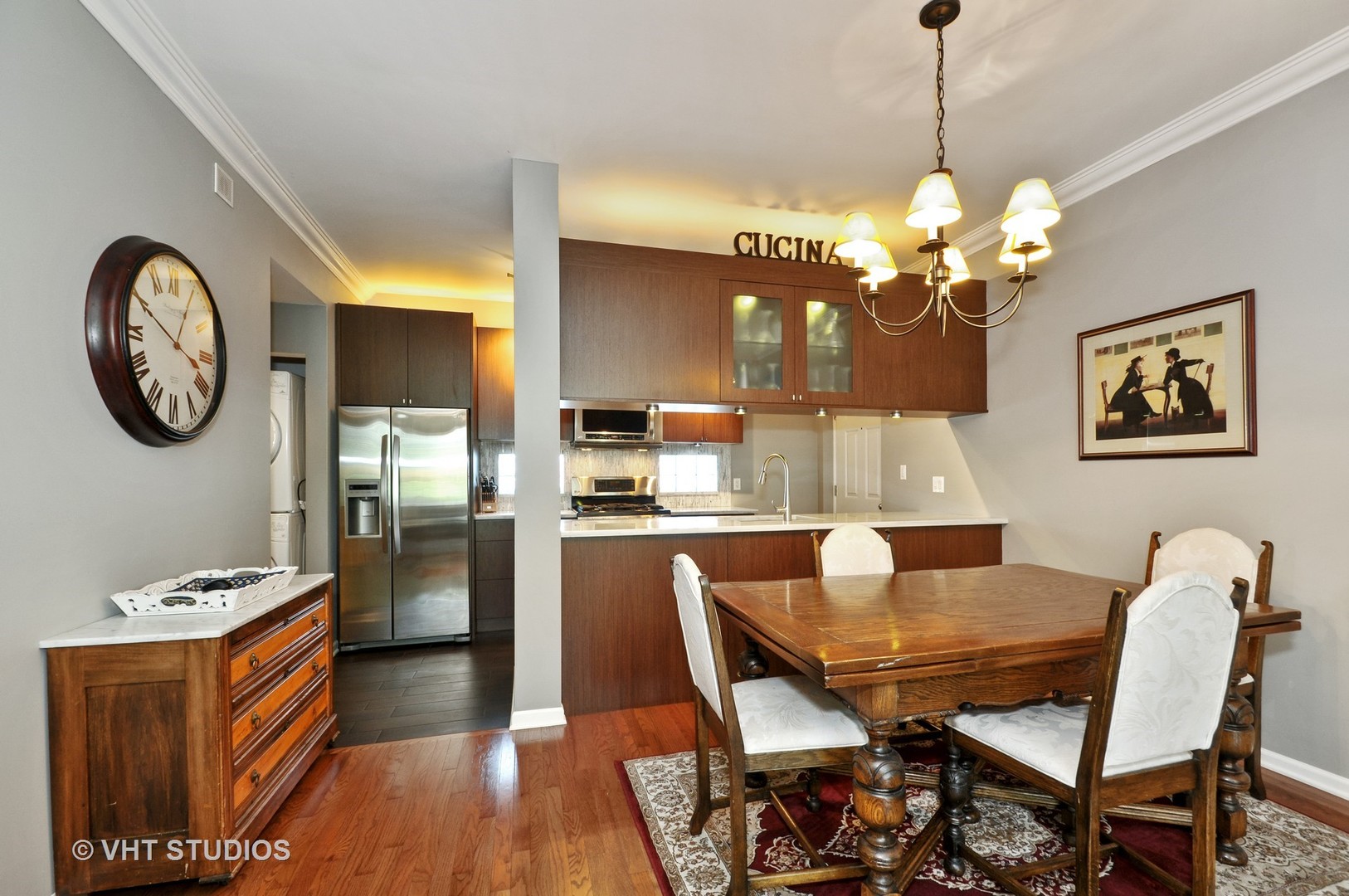 301 West Scott Street, Unit 204 Chicago, IL 60610 - Photo 6 of 11 a view of a dining room with furniture and chandelier