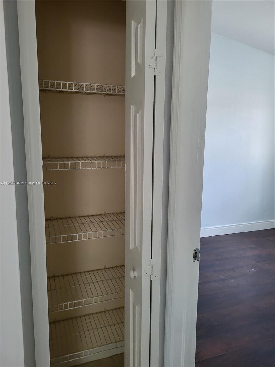 2920 Southeast 12th Road, Unit 20130 Homestead, FL 33035 - Photo 6 of 11 a walk in closet with wooden floor