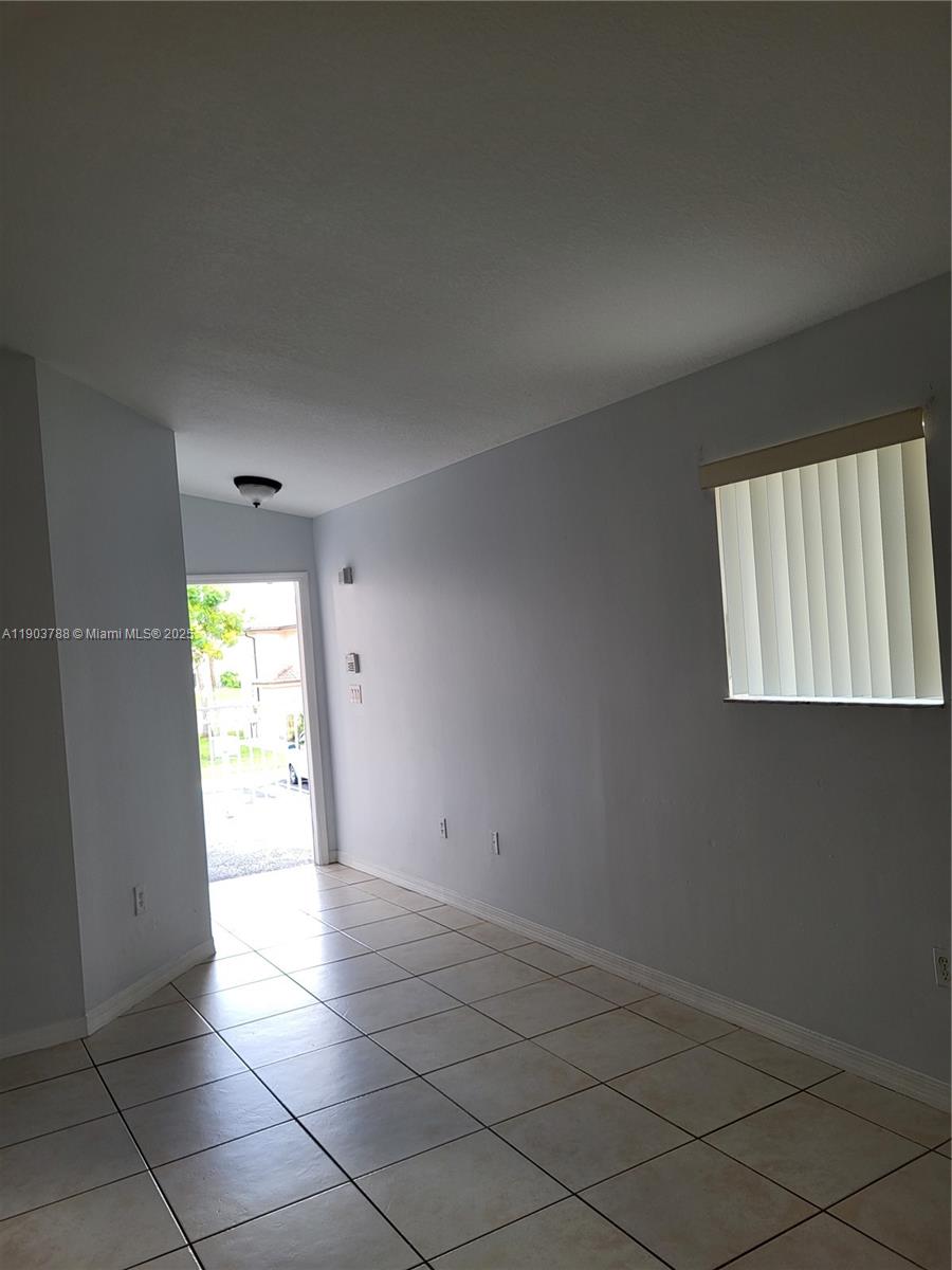 2920 Southeast 12th Road, Unit 20130 Homestead, FL 33035 - Photo 9 of 11 a view of an empty room with a window