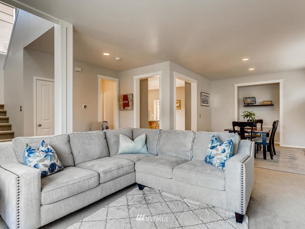 16624 Southeast 169th Street Renton, WA 98058 - Photo 4 of 21 a living room with furniture and a large window