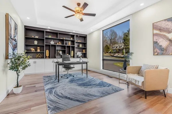 a living room with furniture and a potted plant