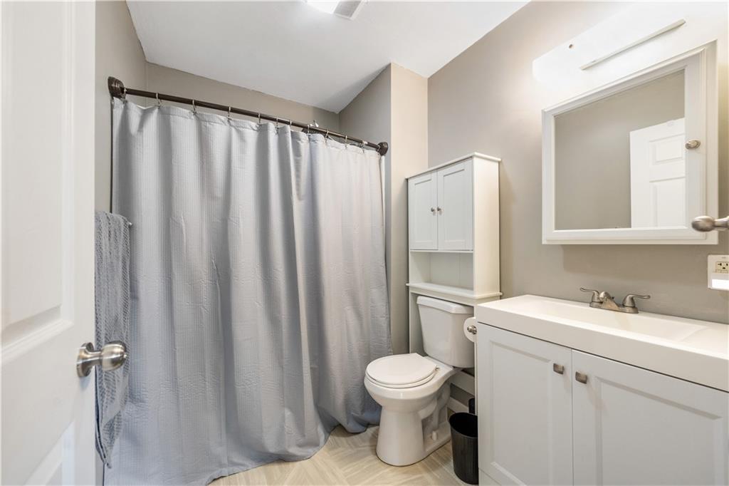 2109 Ridge Boulevard Connellsville, PA 15425 - Photo 15 of 22 a bathroom with a sink a toilet and shower