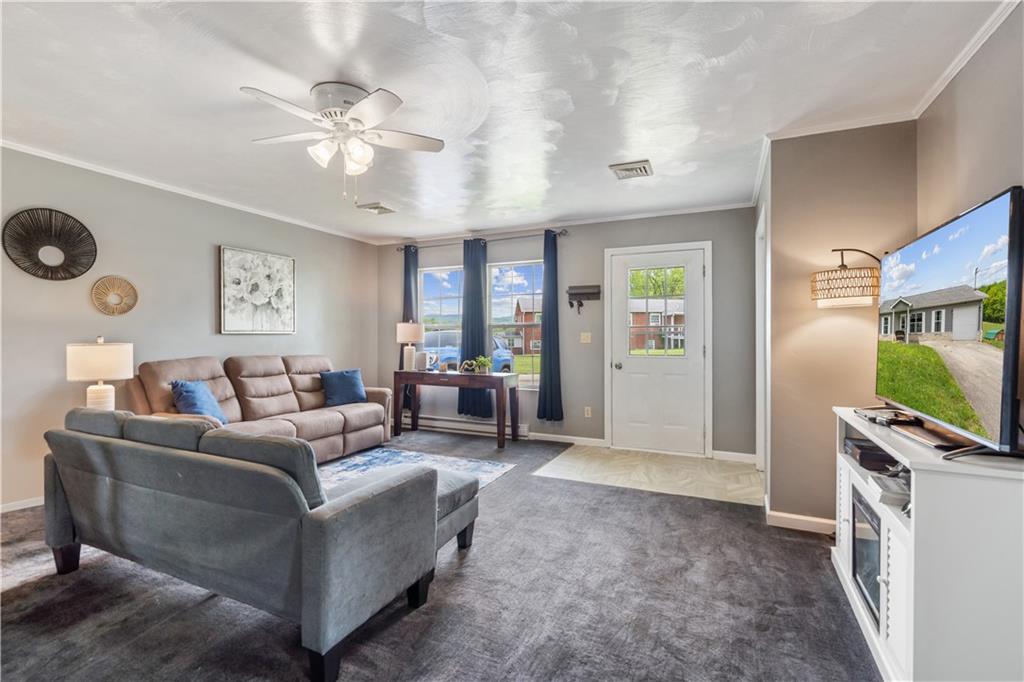 2109 Ridge Boulevard Connellsville, PA 15425 - Photo 5 of 22 a living room with furniture and a flat screen tv