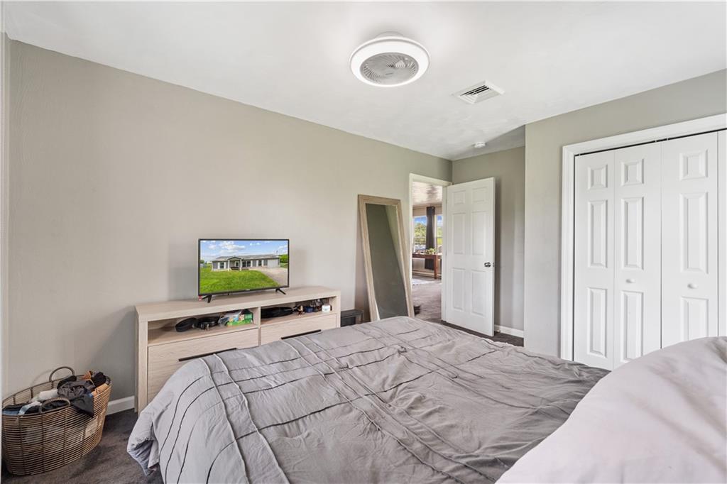 2109 Ridge Boulevard Connellsville, PA 15425 - Photo 10 of 22 a bedroom with a bed and a flat screen tv