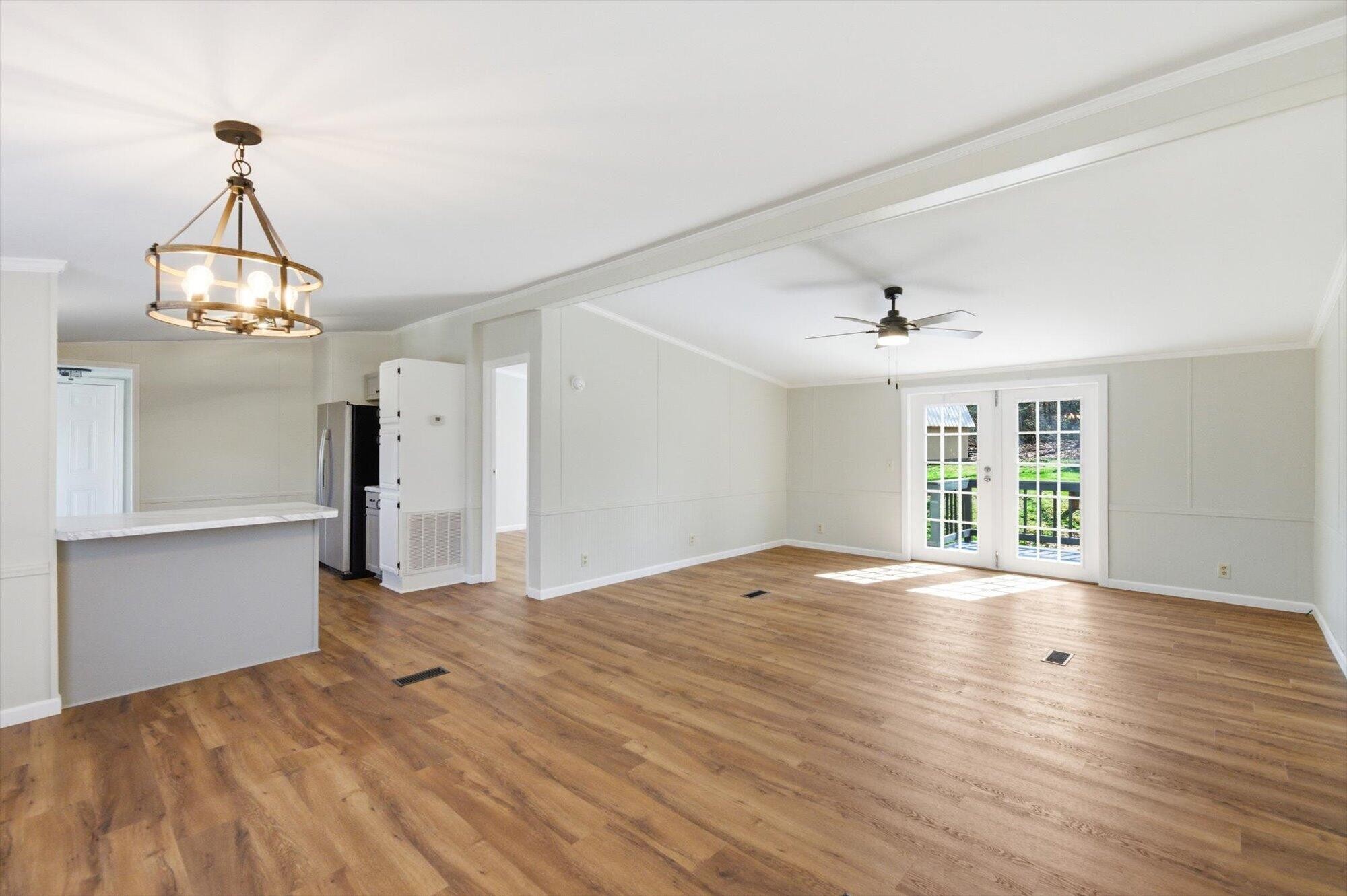 64 County Road 100 Decatur, TN 37322 - Photo 3 of 43 a view of empty room with wooden floor and fan
