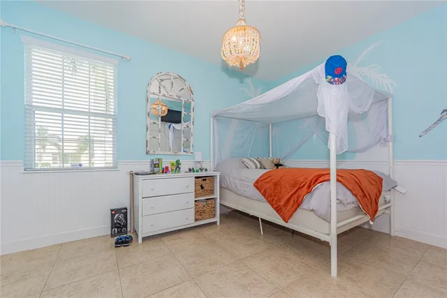 a bed room with a bed and a window