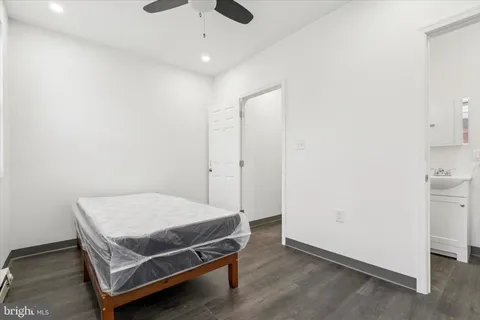 a room with a bed and cabinets