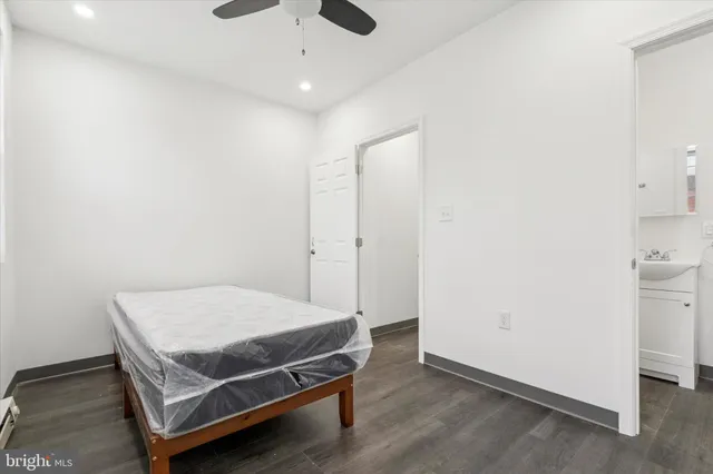 a room with a bed and cabinets