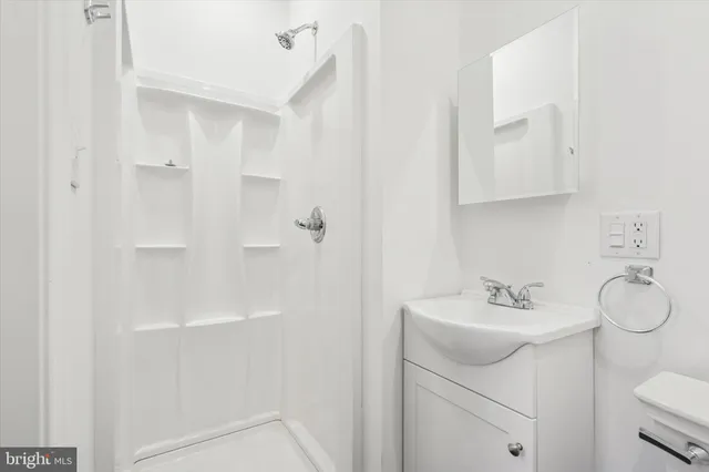 a bathroom with a sink toilet and vanity