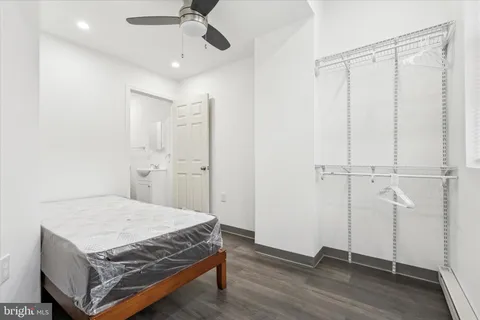 a bedroom with a bed and a table