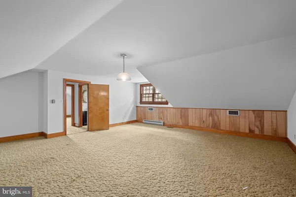 a view of a kitchen with cabinet and stairs