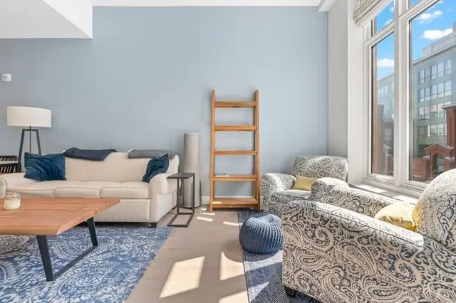 a living room with furniture and a window