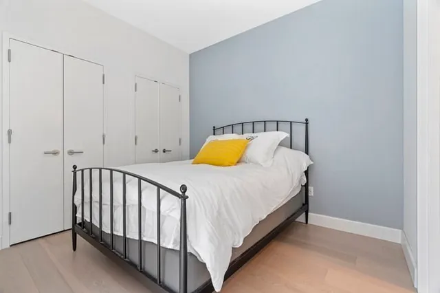 a bedroom with a bed and lamps