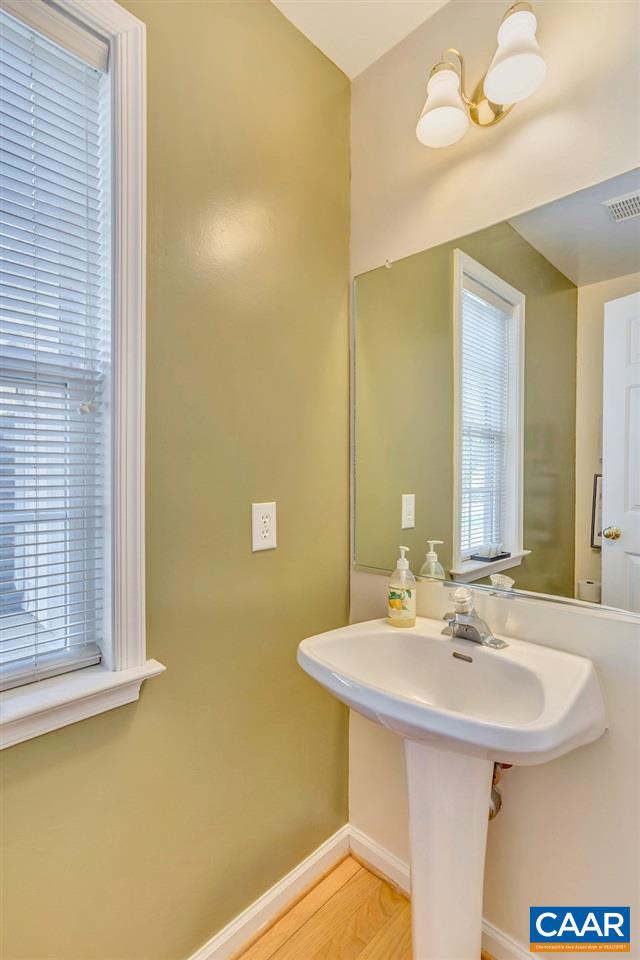 1641 Old Brook Road Charlottesville, VA 22901 - Photo 11 of 22 a bathroom with a sink and a mirror