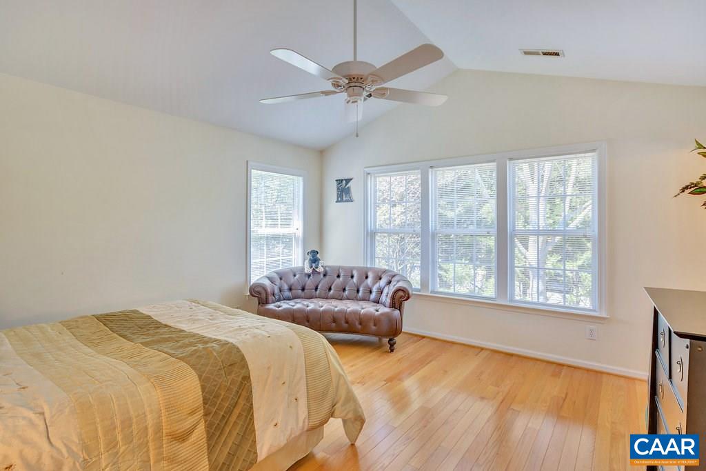 1641 Old Brook Road Charlottesville, VA 22901 - Photo 13 of 22 a bedroom with a bed and a large window