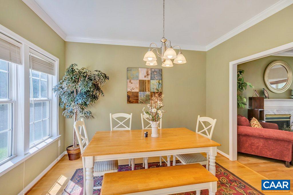 1641 Old Brook Road Charlottesville, VA 22901 - Photo 7 of 22 a view of a dining room with furniture and chandelier