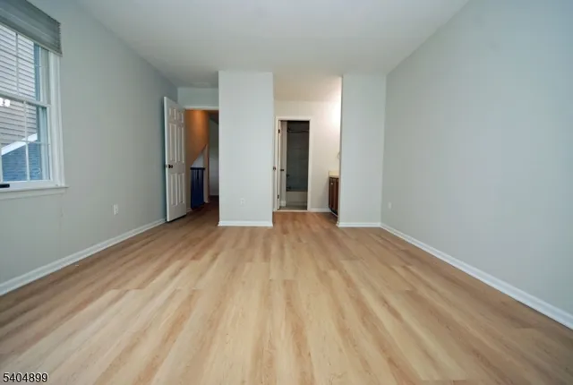 a view of a house with swimming pool and sitting area