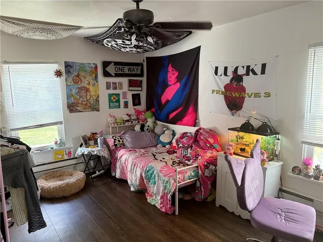 a bedroom with bed and a window