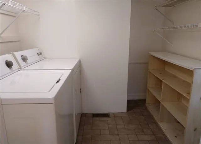 a utility room with dryer and washer