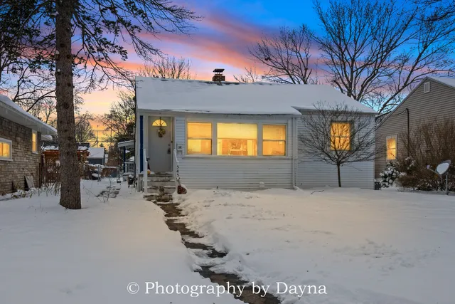 a view of a house with a snow in the yard