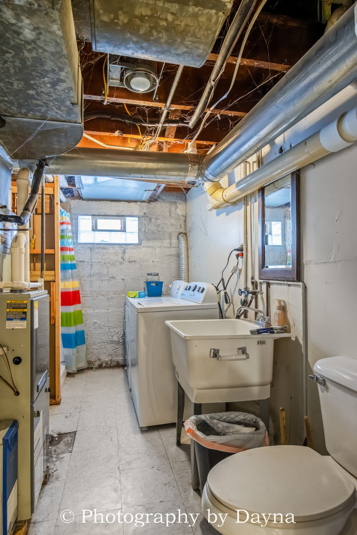 545 South Fraser Avenue Kankakee, IL 60901 - Photo 27 of 33 a room with water heater and a wooden floors