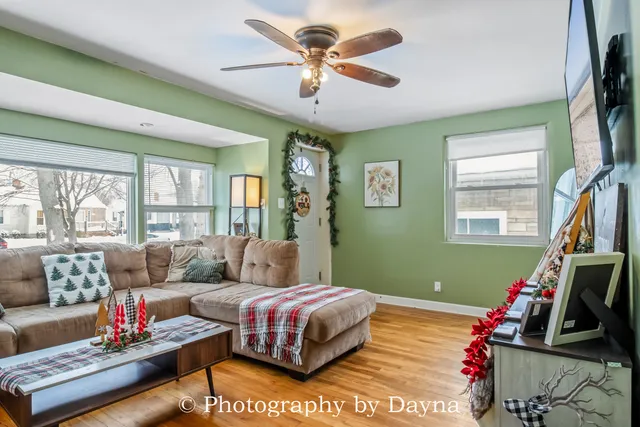 a bedroom with a bed couch and a window