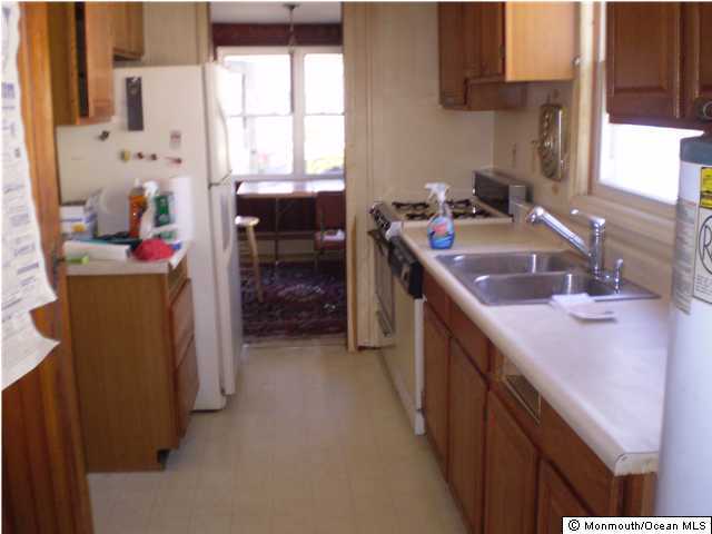 1217 Maplewood Road, Unit 2 Belmar, NJ 07719 - Photo 3 of 3 a kitchen with sink cabinets and window