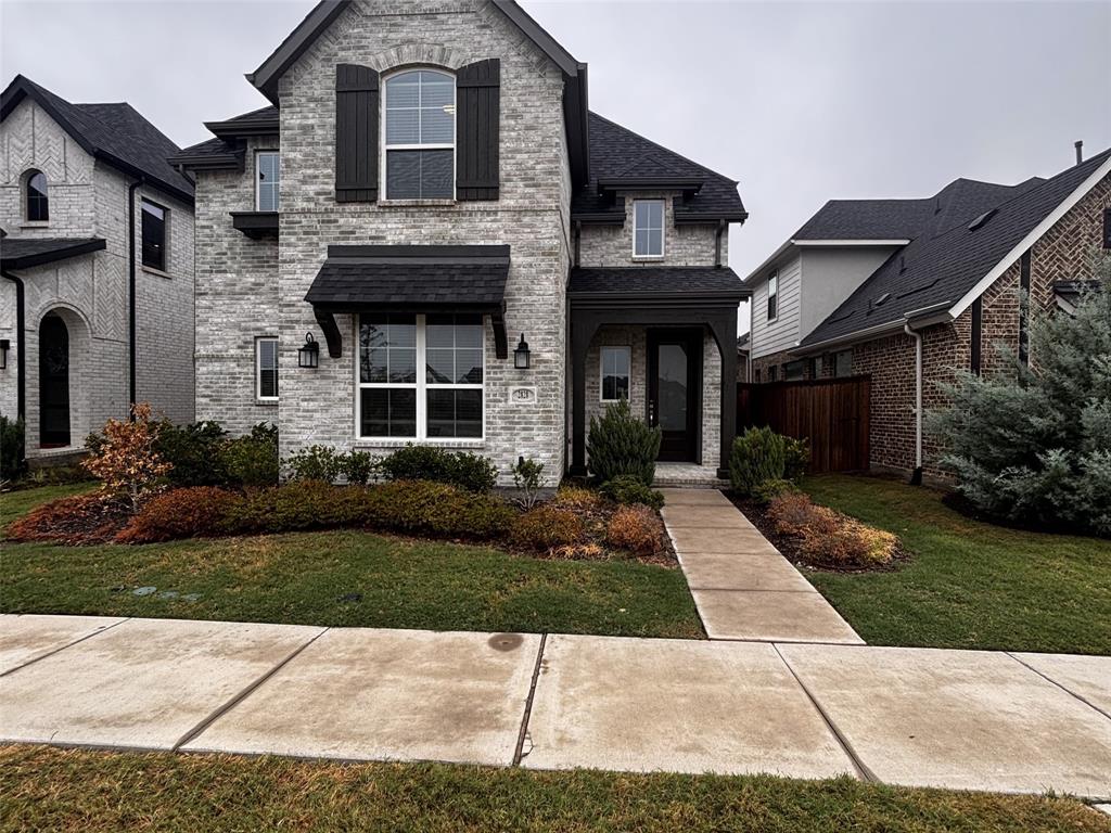 2828 Walden Road Celina, TX 75009 - Photo 1 of 30 Gray brick exterior with dark trim and shutters