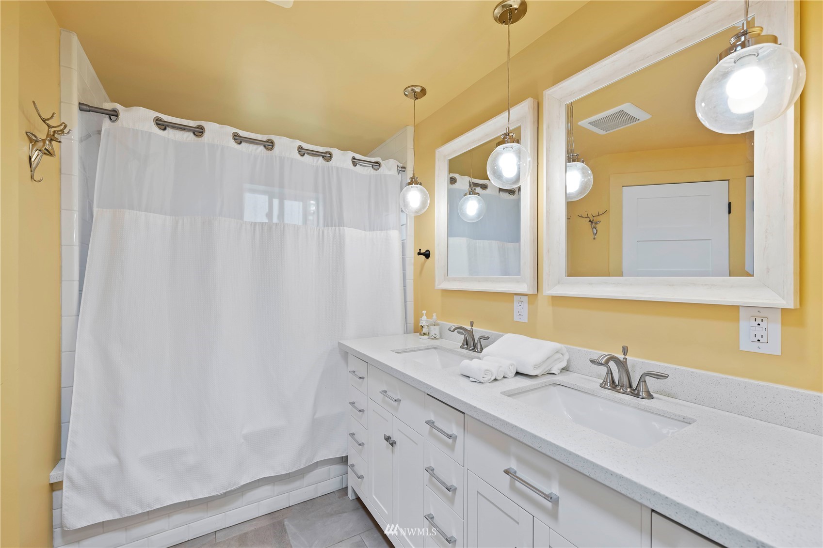 105 234th Place Southwest Bothell, WA 98021 - Photo 16 of 27 a bathroom with double vanity sink and a mirror