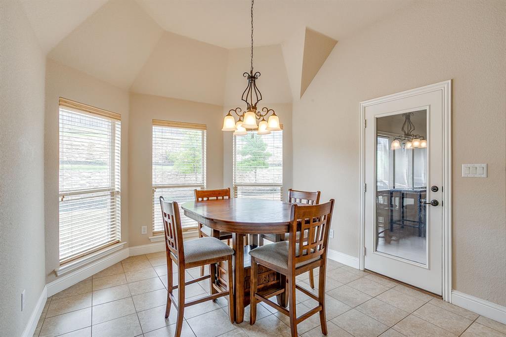 9815 Ravenswood Road Granbury, TX 76049 - Photo 17 of 40 a dining room with furniture and window