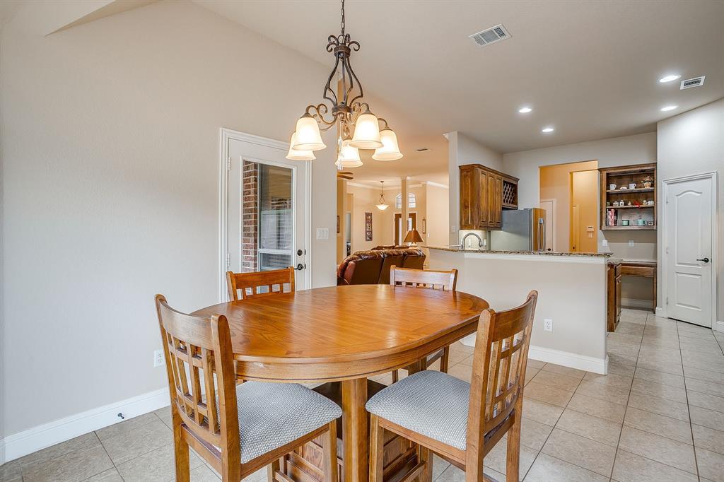 9815 Ravenswood Road Granbury, TX 76049 - Photo 19 of 40 a dining room with furniture and window