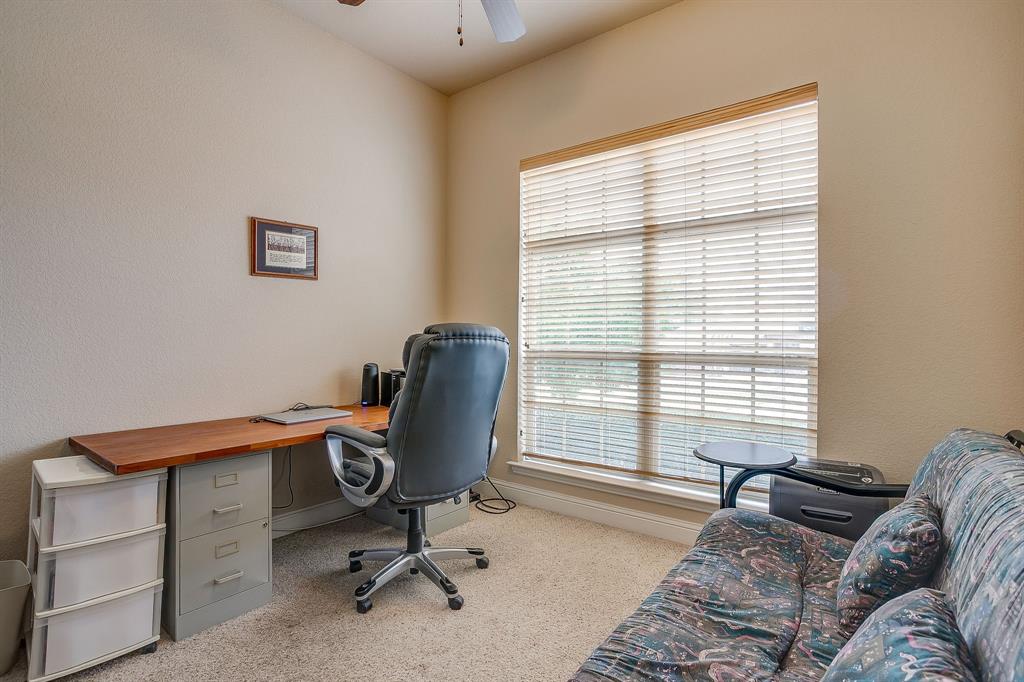 9815 Ravenswood Road Granbury, TX 76049 - Photo 27 of 40 a livingroom with workspace and a window