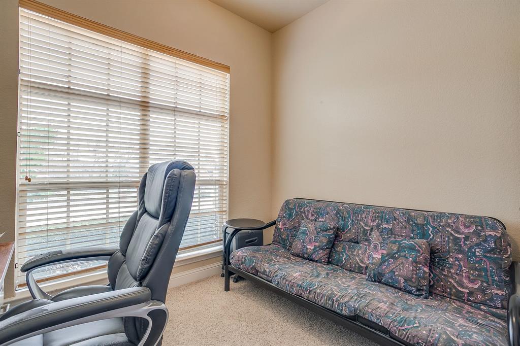 9815 Ravenswood Road Granbury, TX 76049 - Photo 28 of 40 a living room with a couch and a window