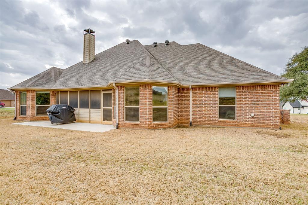 9815 Ravenswood Road Granbury, TX 76049 - Photo 38 of 40 a house view with a garden space