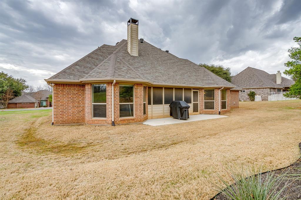 9815 Ravenswood Road Granbury, TX 76049 - Photo 39 of 40 a house view with a garden space